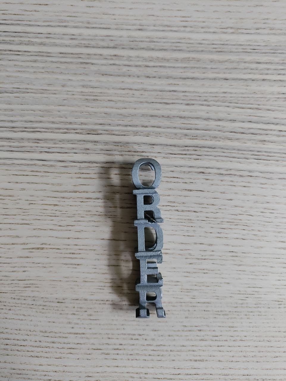 Order & Chaos — Steel Vertical — view 1